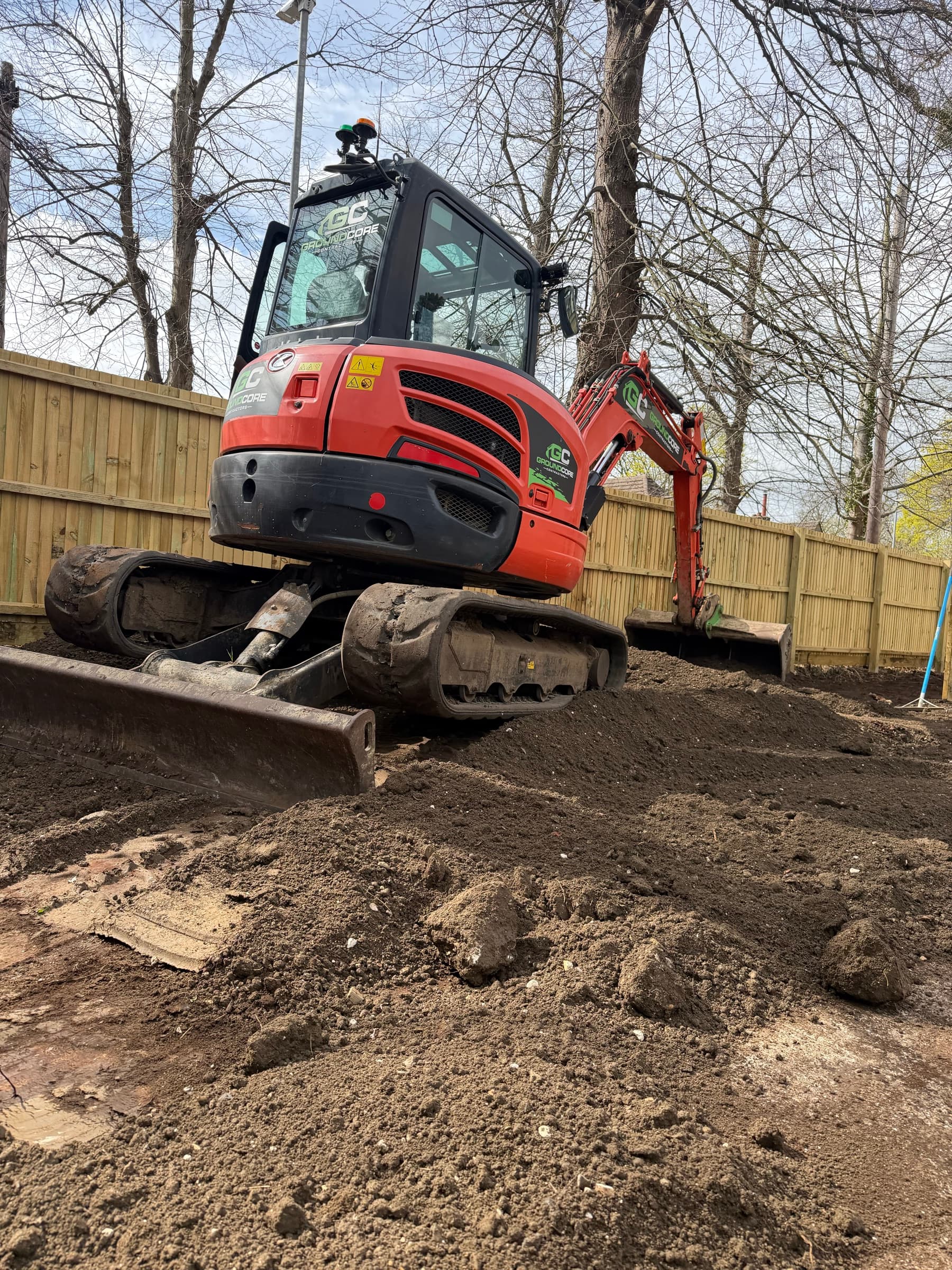 A GroundCore excavator carrying out earthworks and levelling a plot in Cambridge