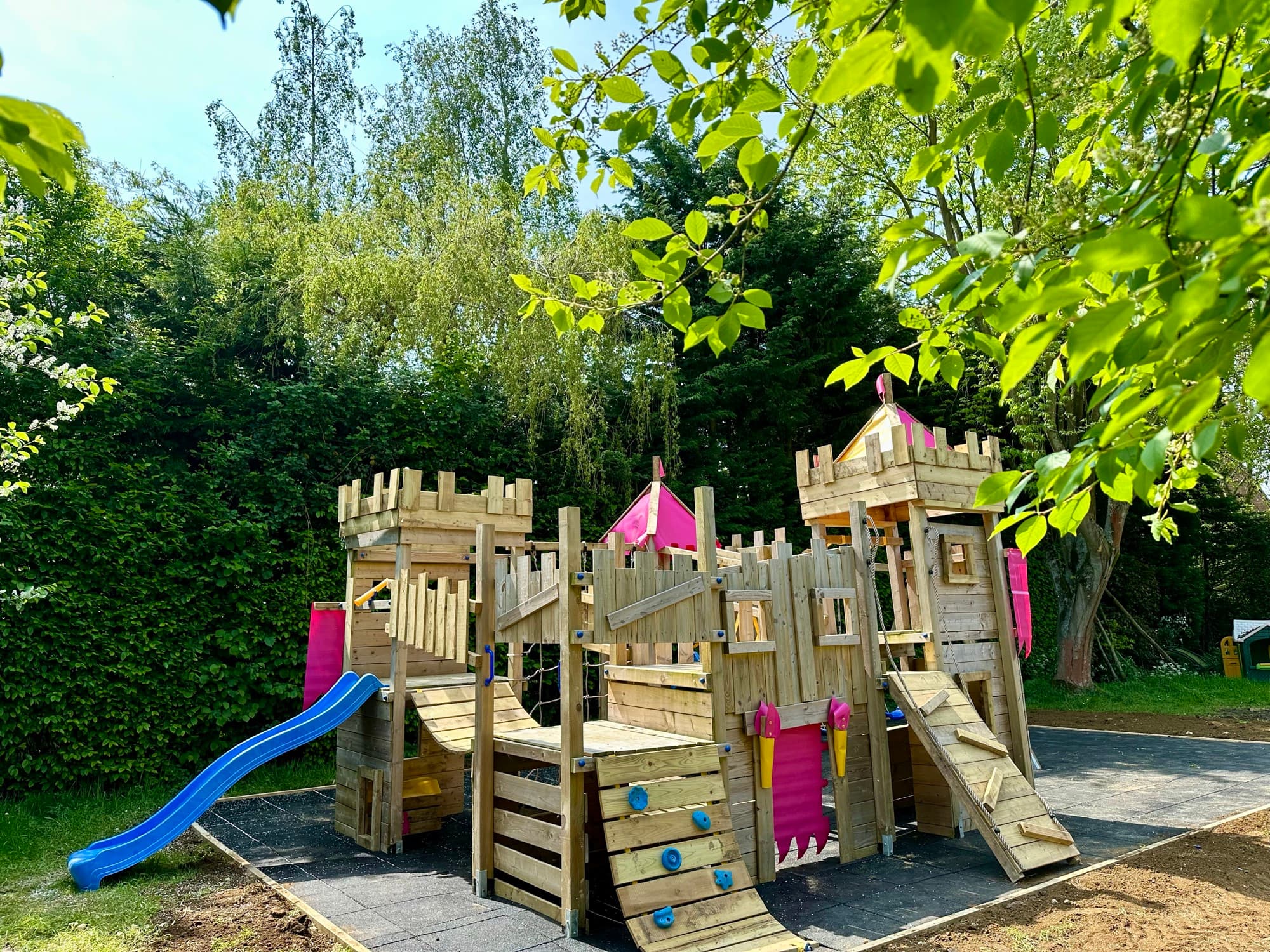 A timber play area built on site